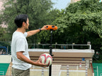 Installing a Ballr AI sports camera beside a football pitch